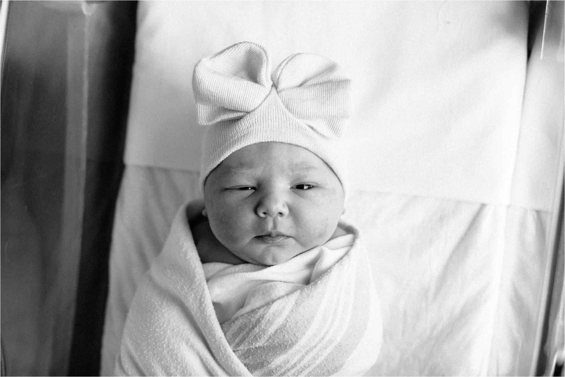 newborn baby girl in hospital hat prentice